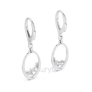 Silver earrings with small diamonds on a white background